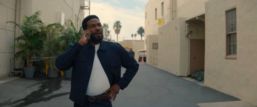 Simon on the phone on a Hollywood backlot.