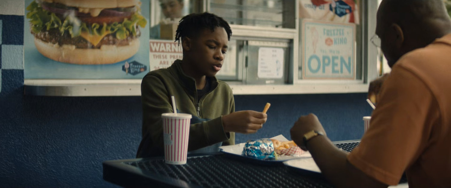 Young Simon and Sanford enjoy food at Freezee King.
