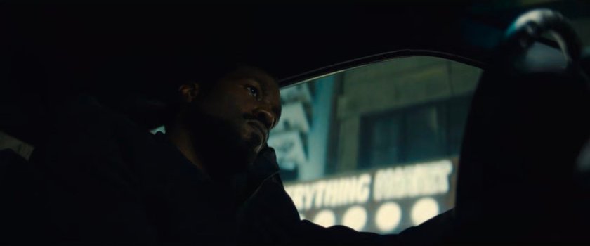 Simon driving his car around town at nighttime.