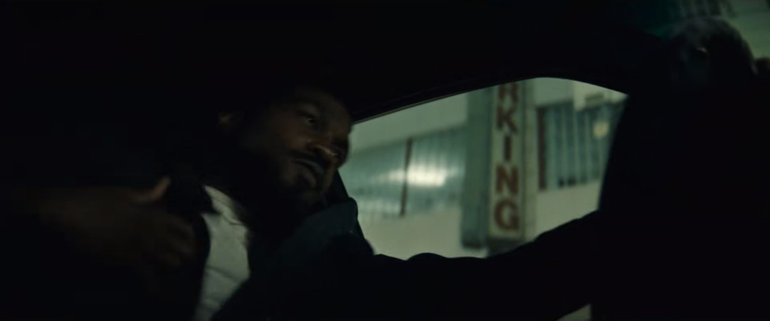 Simon driving his car around town at nighttime.