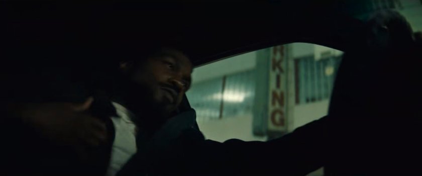 Simon driving his car around town at nighttime.