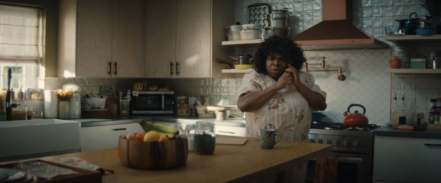 Martha on the phone in the Williams family kitchen.