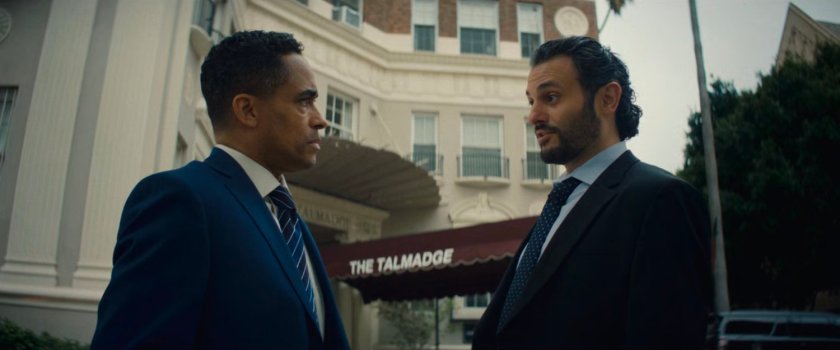 Marco and Cleary outside Trevor's apartment building.