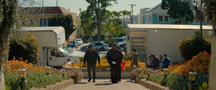 Simon walking up a stairway to the Wonder Man filming house.
