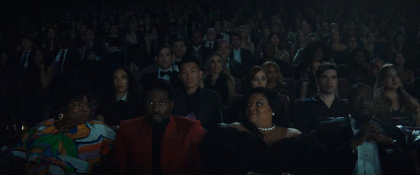 Martha, Simon, Janelle, and Eric in a packed theater watching premier of Wonder Man.