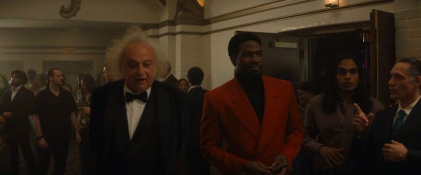 Simon and Von Kovac in the lobby of the movie theater.