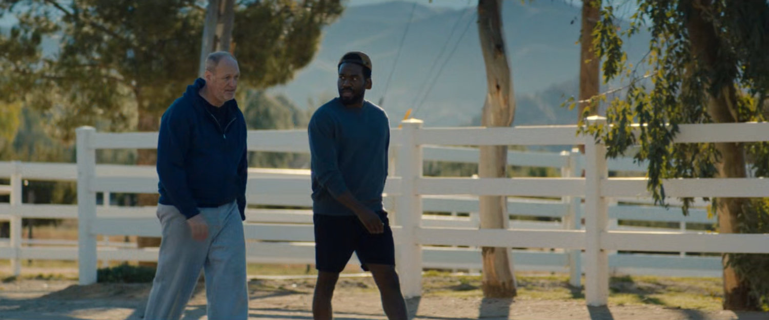 Simon and Chuck jogging on a road in Yucca Valley.