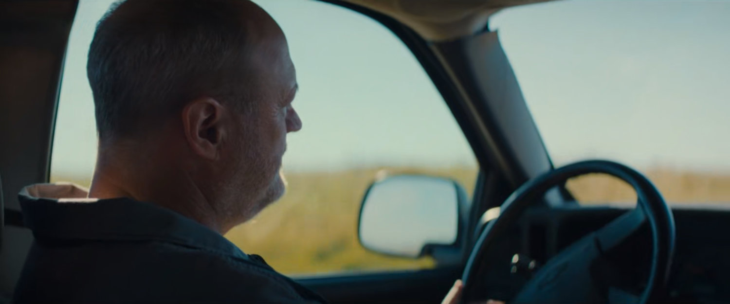 Chuck driving to work.