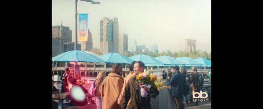 BB Report: Pedestrians by blue umbrellas.