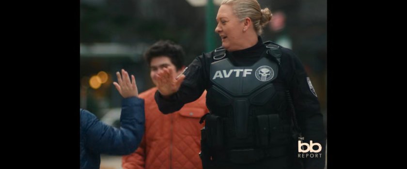 BB Report: a small child high-fiving an AVTF officer.