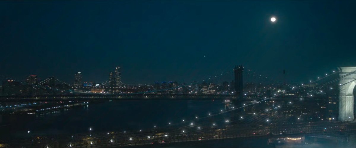 Bridges over the East River at night.