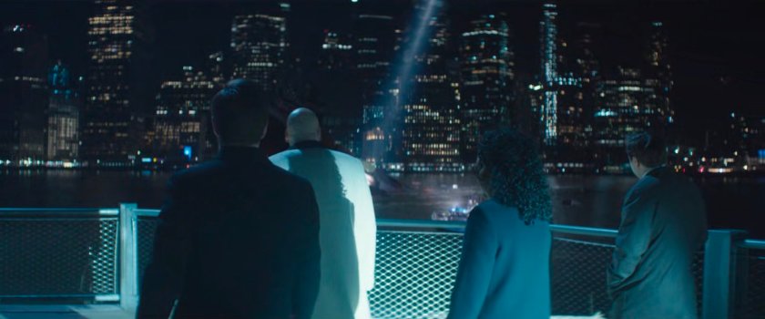 Buck, Fisk, Sheila, and Daniel on an East River pier at night.
