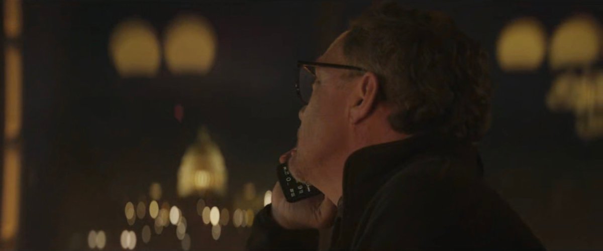 Mr Charles on the phone in a Washington bar.