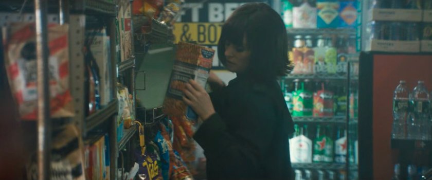 A disguised Karen retrieving paperwork from its hiding place in a bodega by the port.