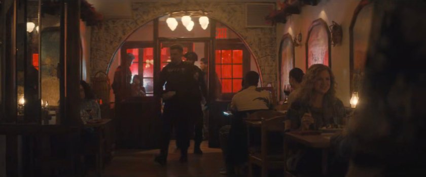 AVTF agent Powell entering the Aegean Gardens restaurant.