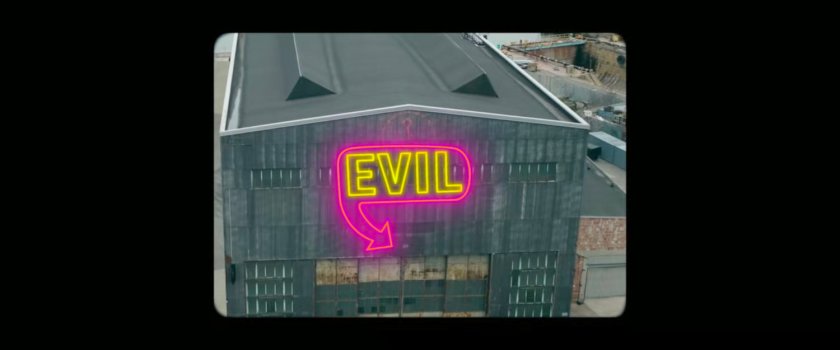 Fisk Report: A neon sign for 'Evil' on a warehouse at the port.