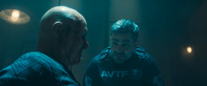 Powell talks to Achilleo in a secret AVTF warehouse.