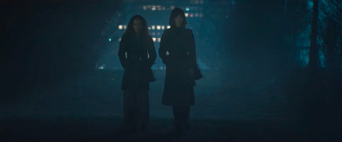 BB and a disguised Karen walk through a dark and foggy park.