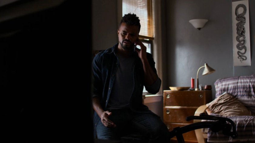 Malcolm in his apartment.