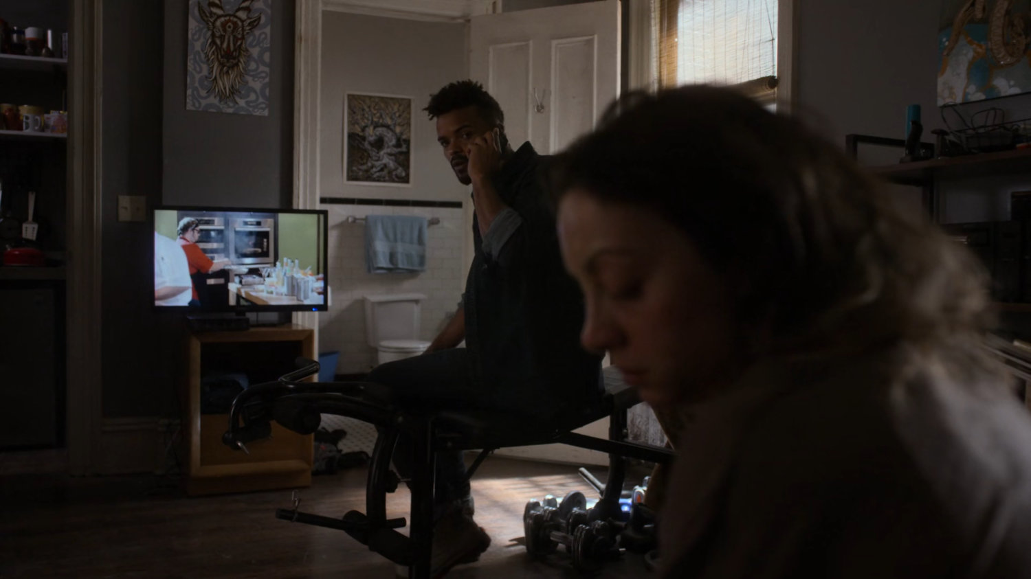 Malcolm and Inez in his apartment.