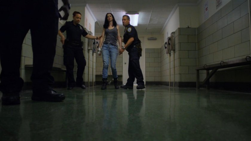 Jessica and officers in the 15th Precinct hallway.