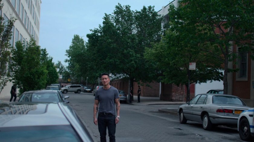 Pryce outside the 15th Precinct station.