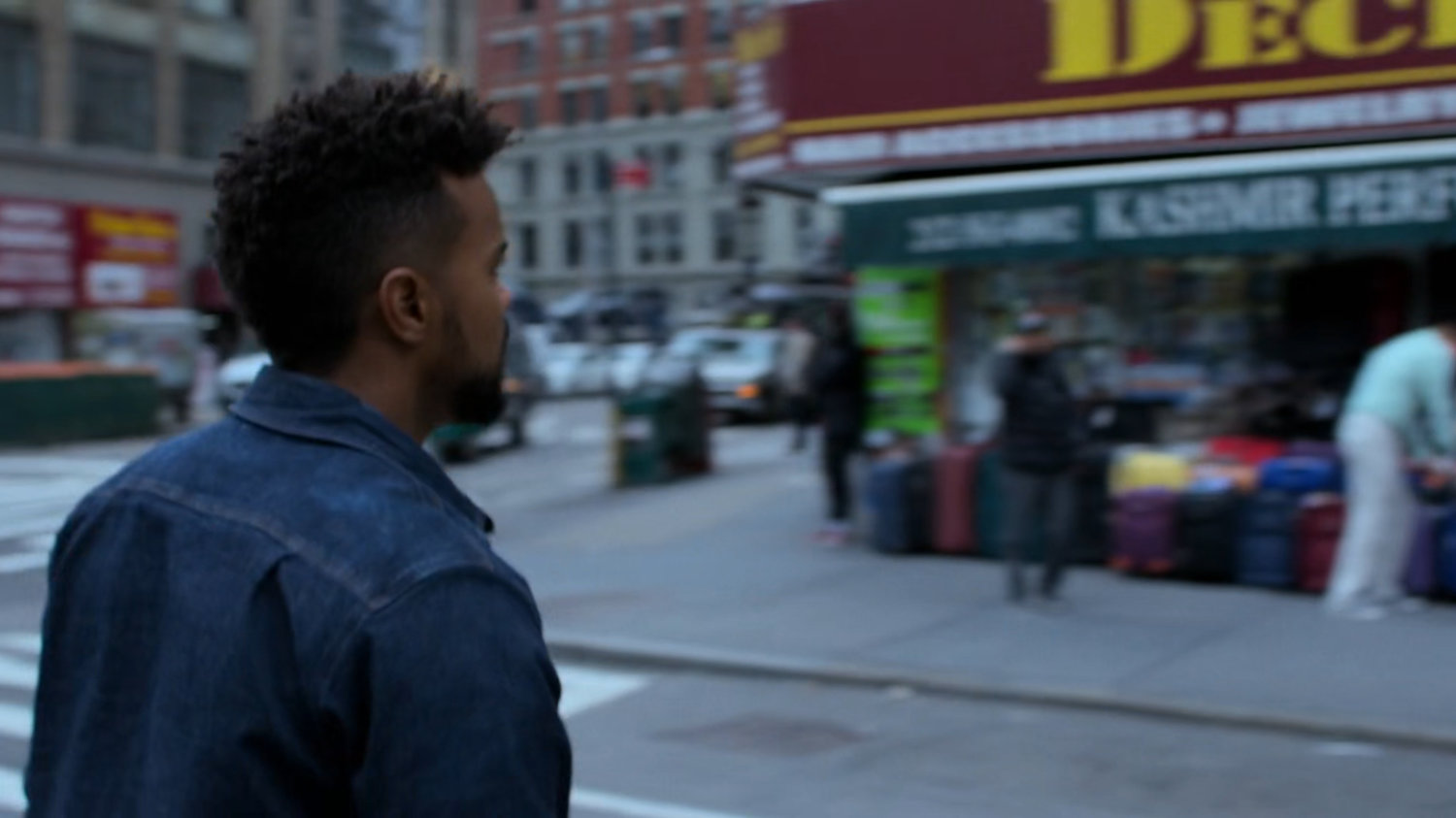 Malcolm crossing a street.