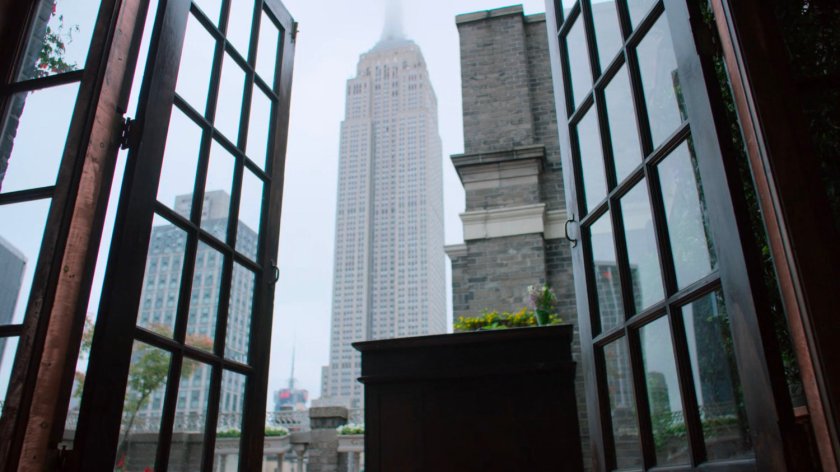The Empire State Building as seen from a rooftop restaurant.