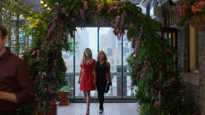 Trish and Dorothy inside of a rooftop restaurant.