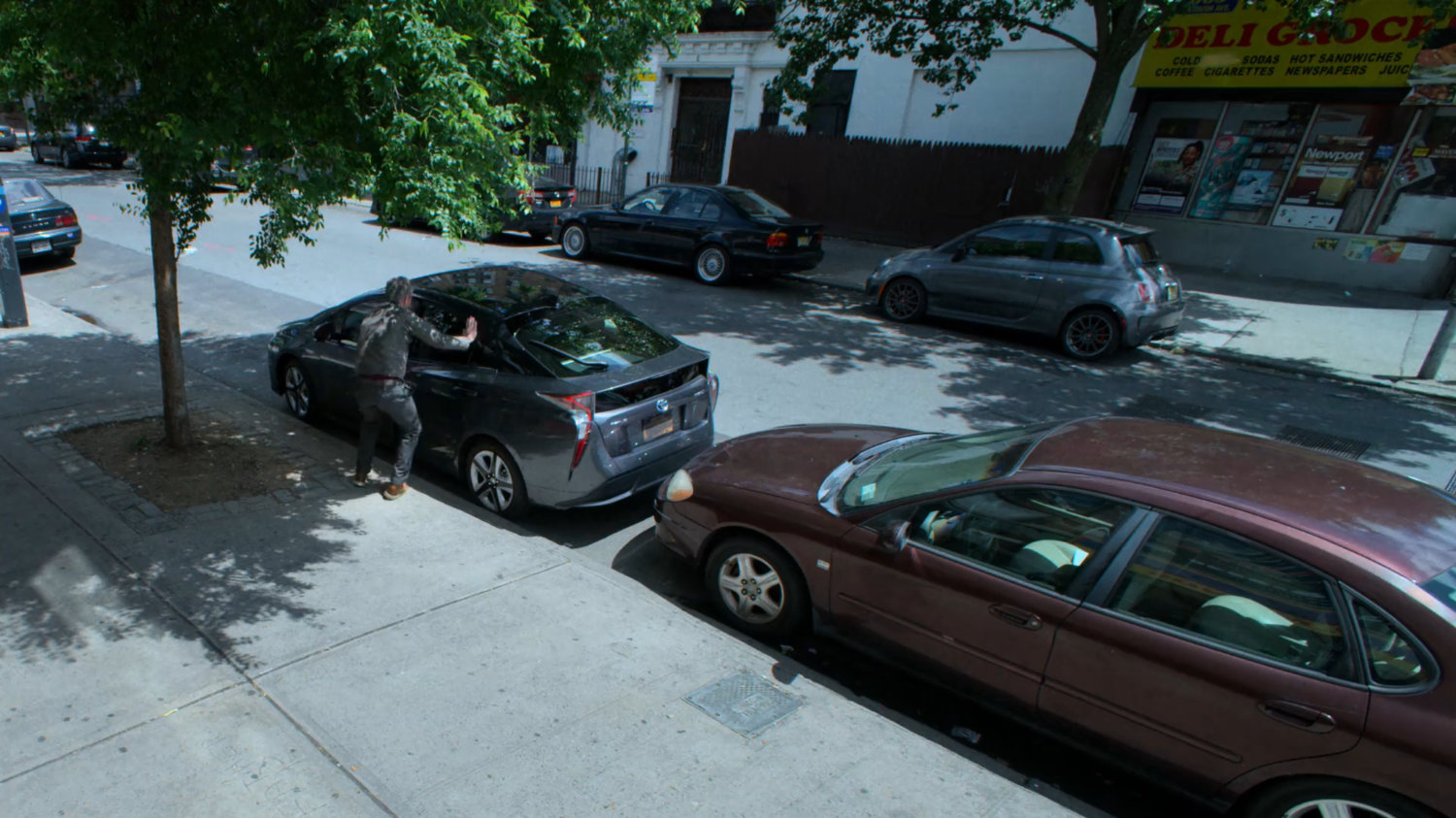 Karl Malus getting into a car parked near the aquarium.