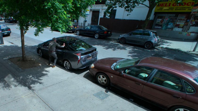 Karl Malus getting into a car parked near the aquarium.