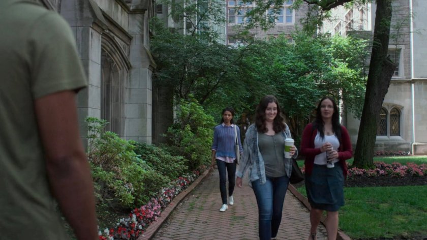 Malcolm approaching Nichelle on a University campus.