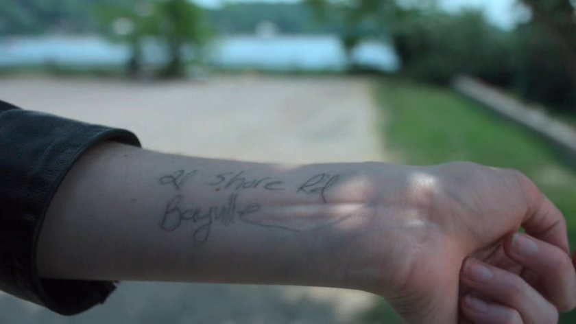Karl's address written on Jessica's forearm.