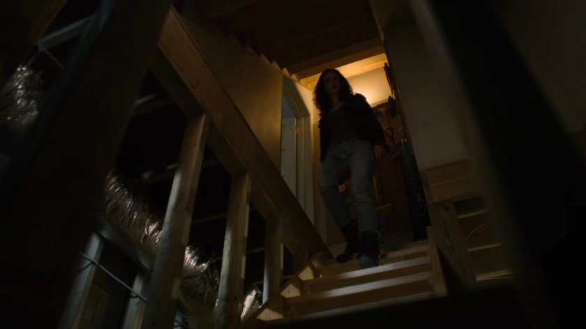 Jessica entering Karl Malus's basement.