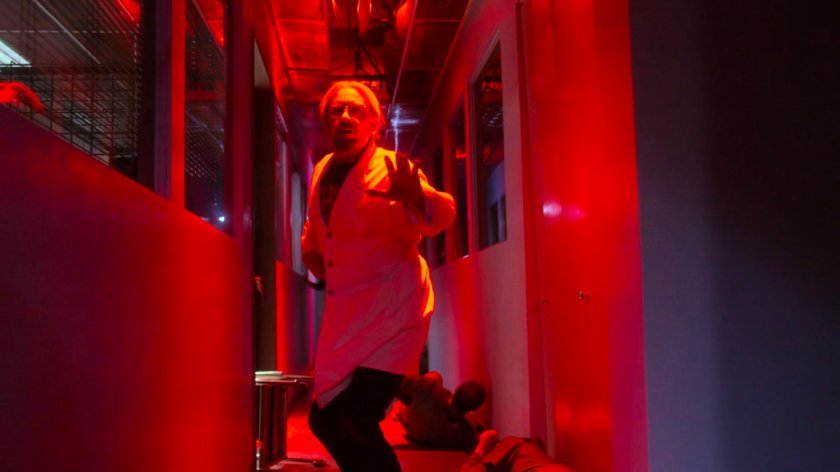 Dr. Karl Malus in a hallway of the Industrial Garments & Handling building.