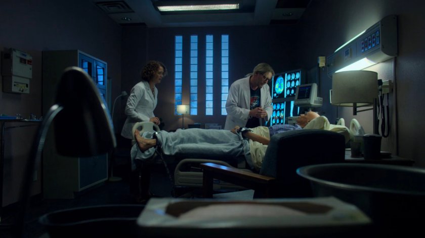 Dr. Leslie Hansen and Dr. Karl Malus work on Alisa in the Industrial Garments & Handling building.