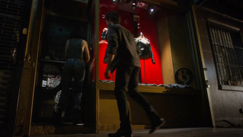 Jessica and Stirling entering a store to steal a leather jacket.