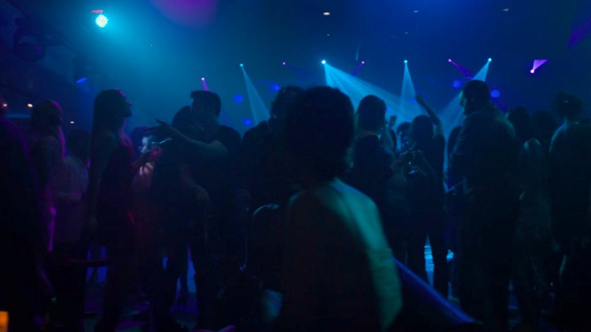 Crowds at a crowded dance club.