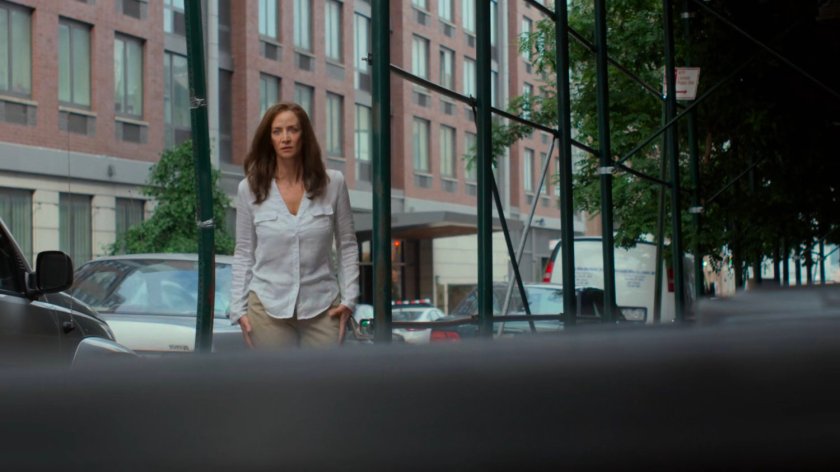 Alisa walking on the sidewalk outside Jessica and Stirling's loft.