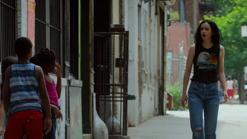 Jessica talks to some kids outside her loft.