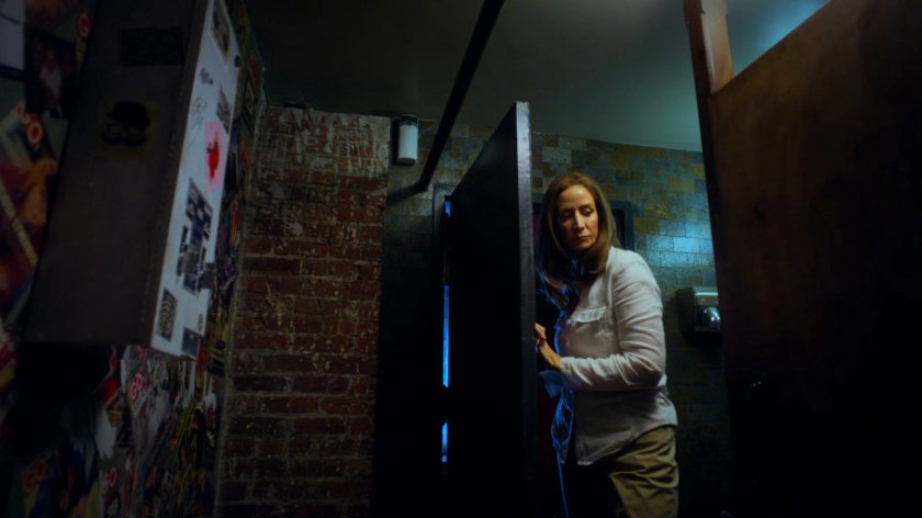 Alisa inside the Phoenix Bar bathroom.