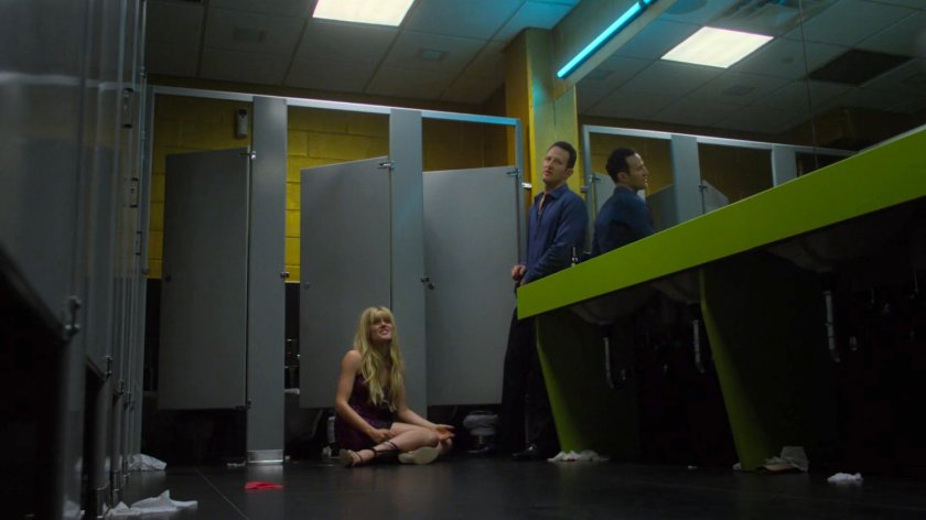 Trish and Gus in the bathroom of the dance club.