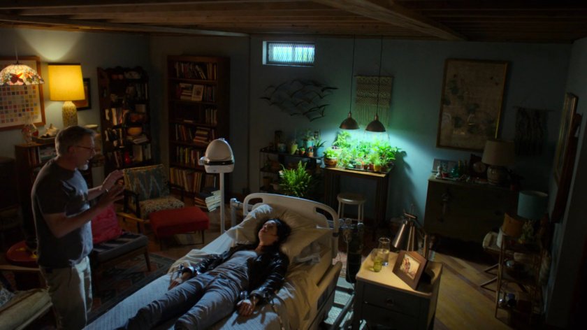 Kark and Jessica inside a room in Karl Malus's basement.