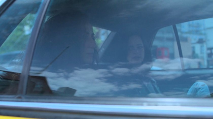 Jessica and Alisa in the back seat of a cab.