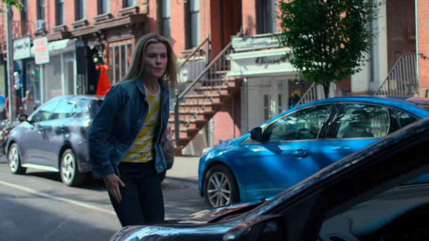 Trish screaming at the driver of a car.