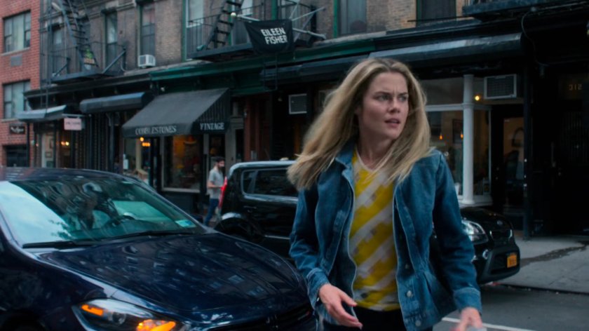 Trish crossing a street.