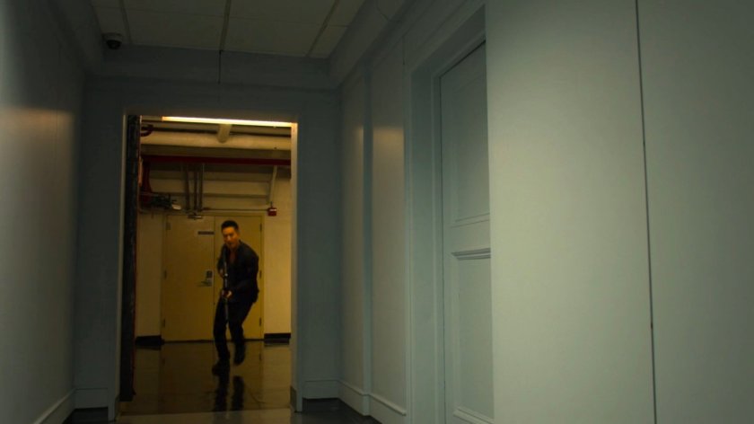 Pryce Cheng running through an apartment hallway.