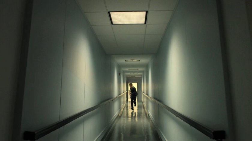 Pryce Cheng running through an apartment hallway.