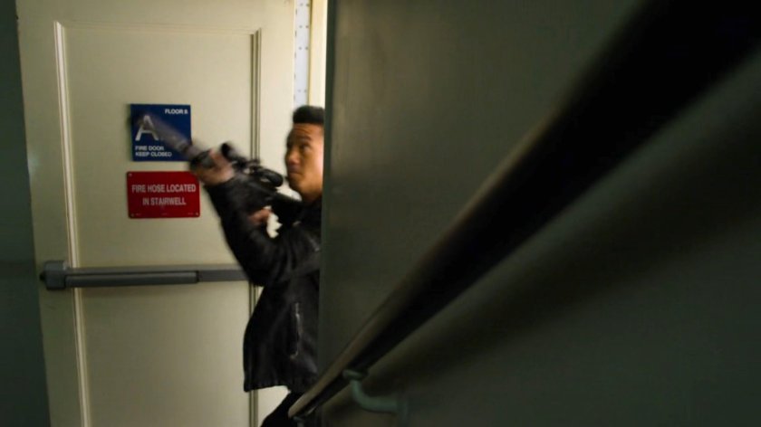 Pryce Cheng running through an apartment stairway.