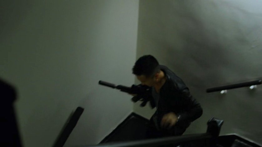 Pryce Cheng running through an apartment stairway.